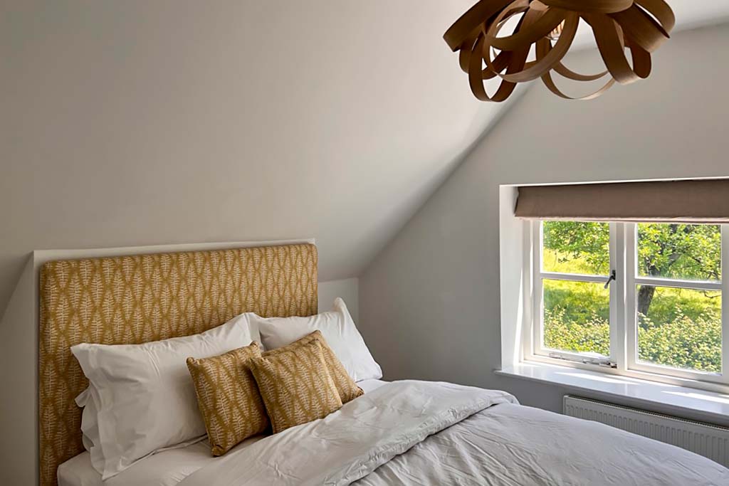 Comfortable double guest bedroom at Vine Cottage with Vineyard views